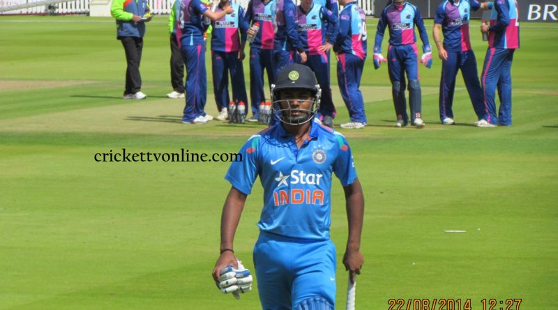 Sanju Samson walking on the field at Lord’s Cricket Ground in 2014, wearing the blue India "Star" jersey and full batting gear.